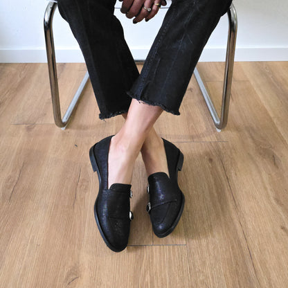 PRISCILLA in rettile nero